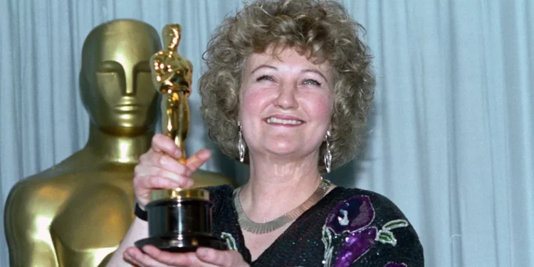 Brenda Fricker holding an Oscar award
