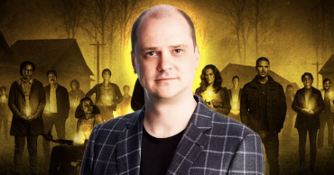 filmmaker and creator Mike Flanagan posed in front of a backdrop showing characters from his horror series Midnight Mass