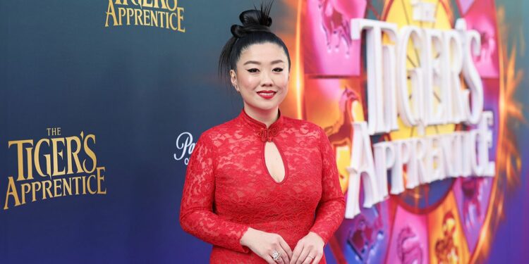 Sherry Cola in a red dress